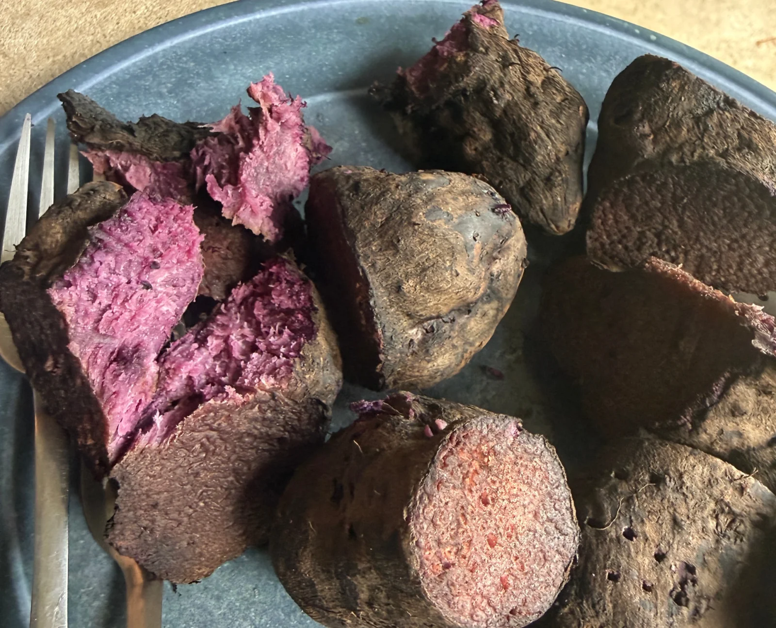 Boiled ube pieces on a plate, the cooked form behind the DOST-FNRI nutrition composition data