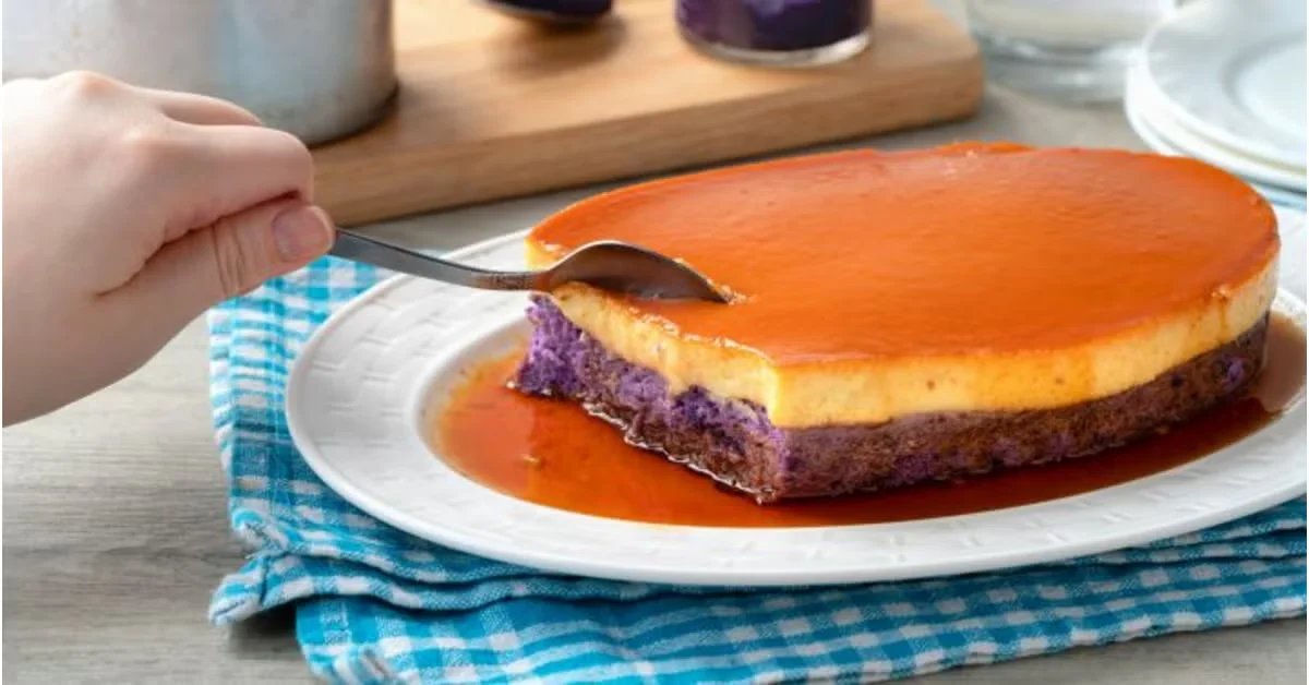 Ube leche flan with purple ube halaya layer and golden caramel custard on a white plate